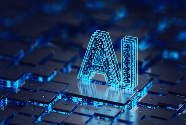 alt="Representación digital del término 'AI' en un entorno tecnológico con bloques y luces azules, simbolizando la inteligencia artificial."